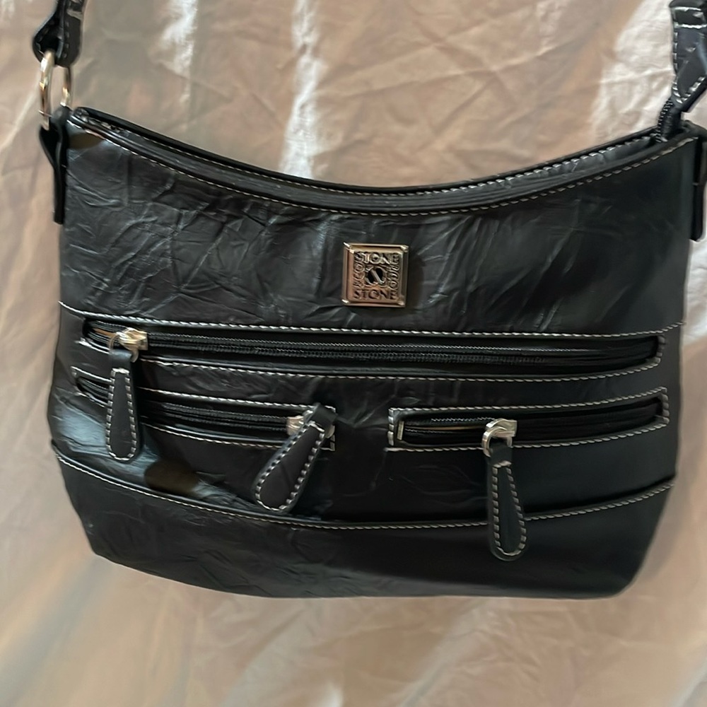 This is a very nice black purse by stone Co.